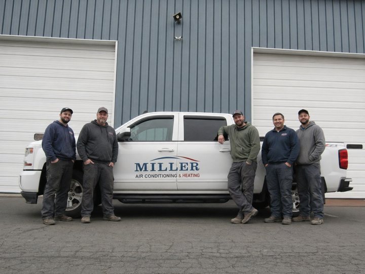 HVAC team in front of their service truck